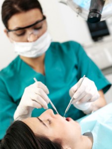 Dentist examining patient